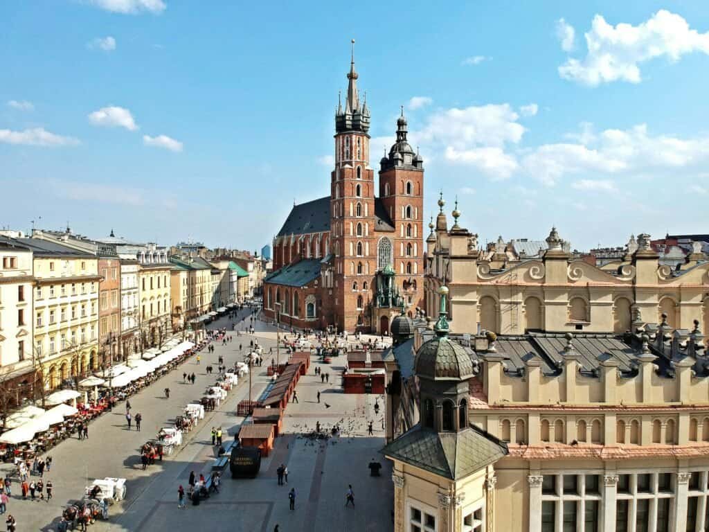 Travel Poland to Hungary: explore Kraków’s historic square, stunning architecture, and vibrant streets on a budget-friendly European adventure.
